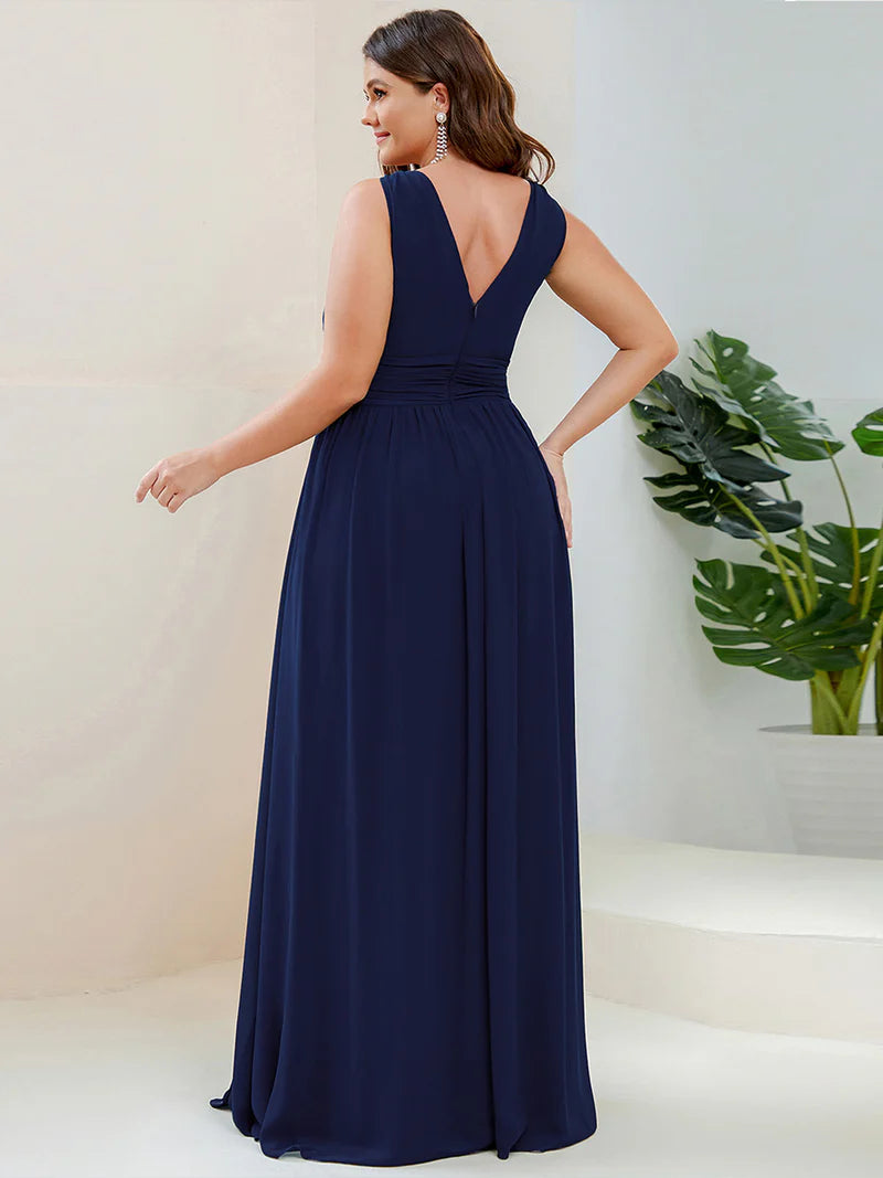 Navy blue plus sized bridesmaid dress with double v-neck and chiffon.