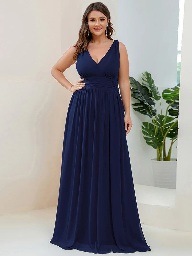 Navy blue plus sized bridesmaid dress with double v-neck and chiffon.
