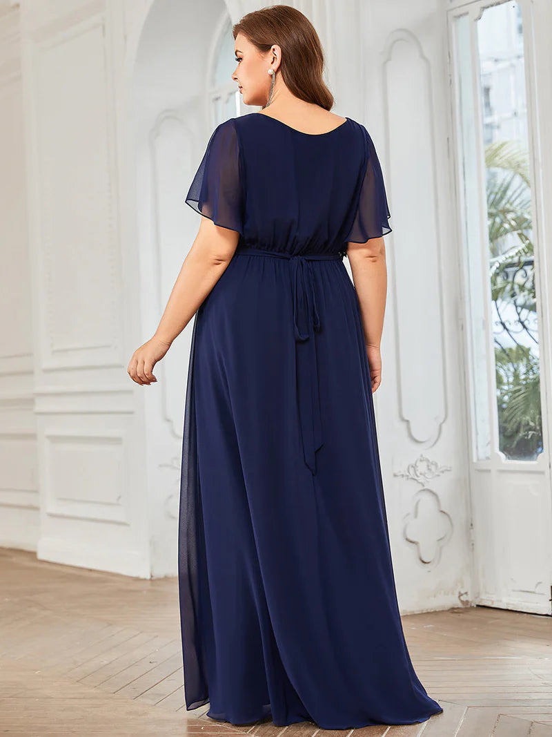Navy blue plus sized bridesmaid dress with v-neck and a-line.