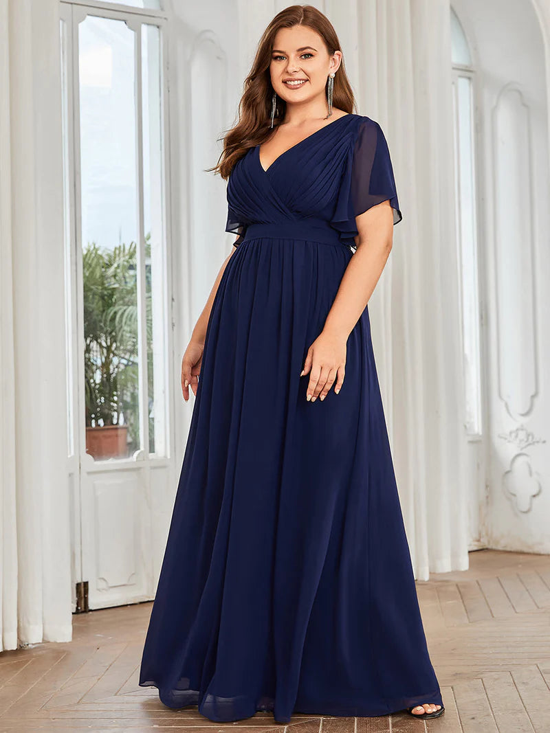 Navy blue plus sized bridesmaid dress with v-neck and a-line.