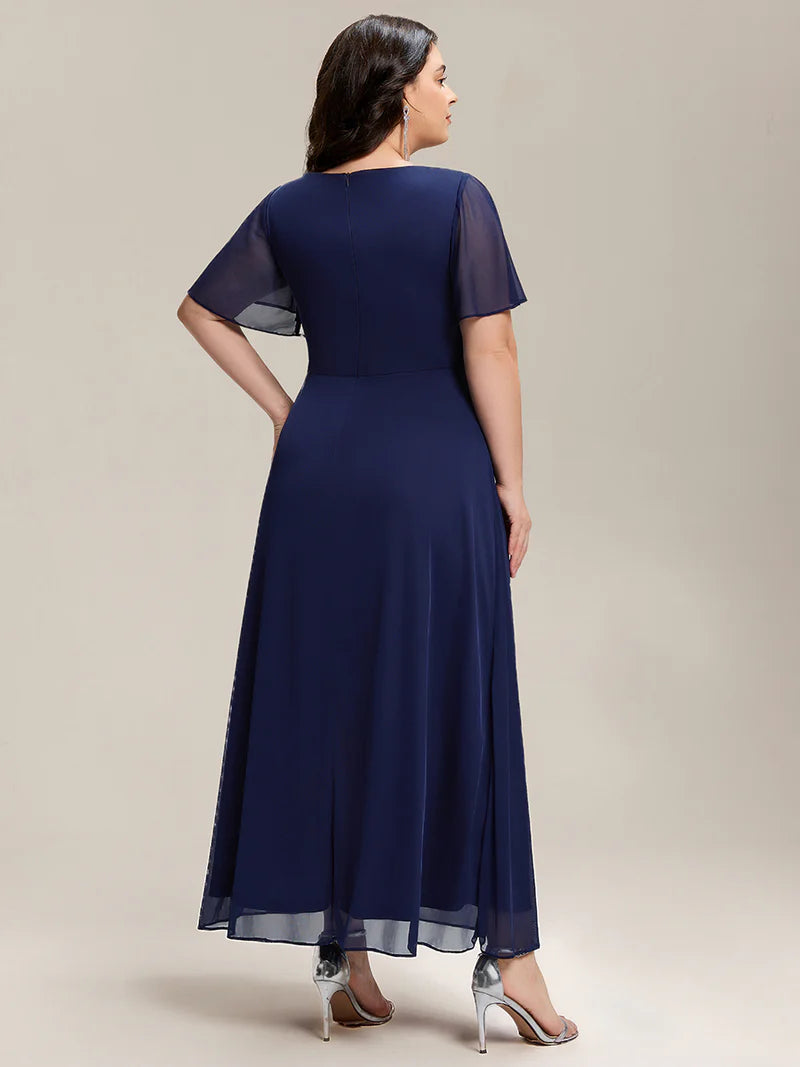 Navy Blue plus size wedding guest dress with short sleeves and rhinestone embellishment.