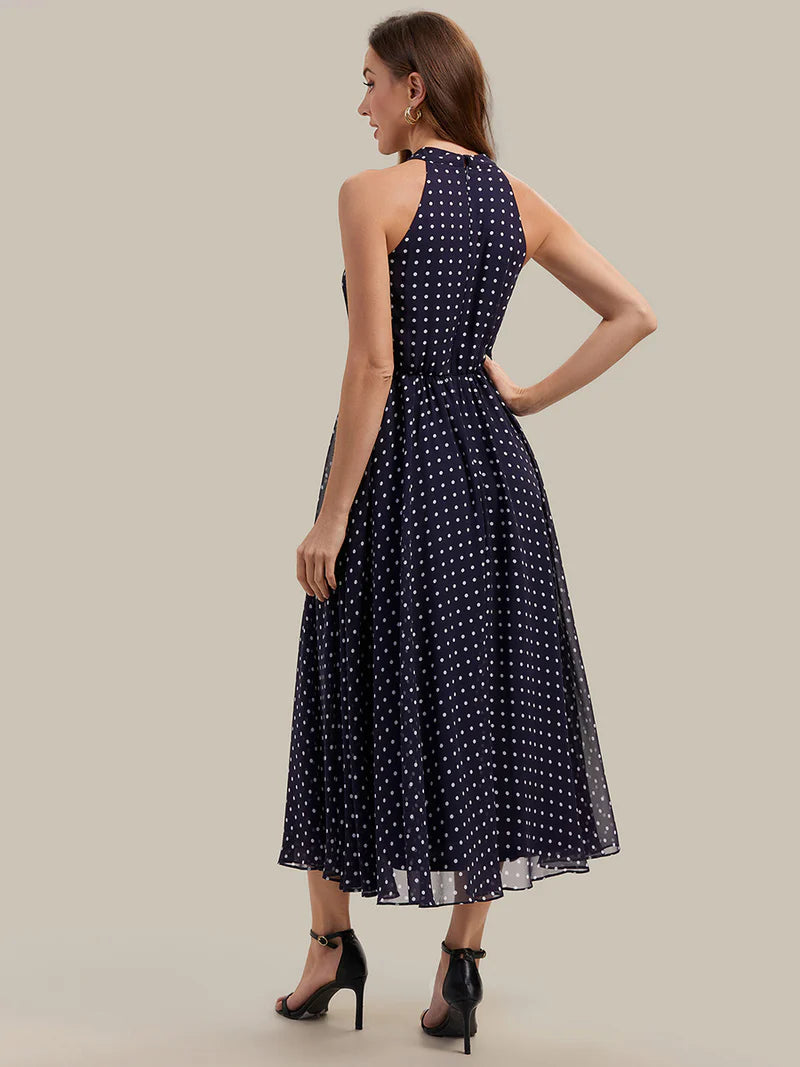 Navy blue polka dot halter wedding guest dress or evening dress.