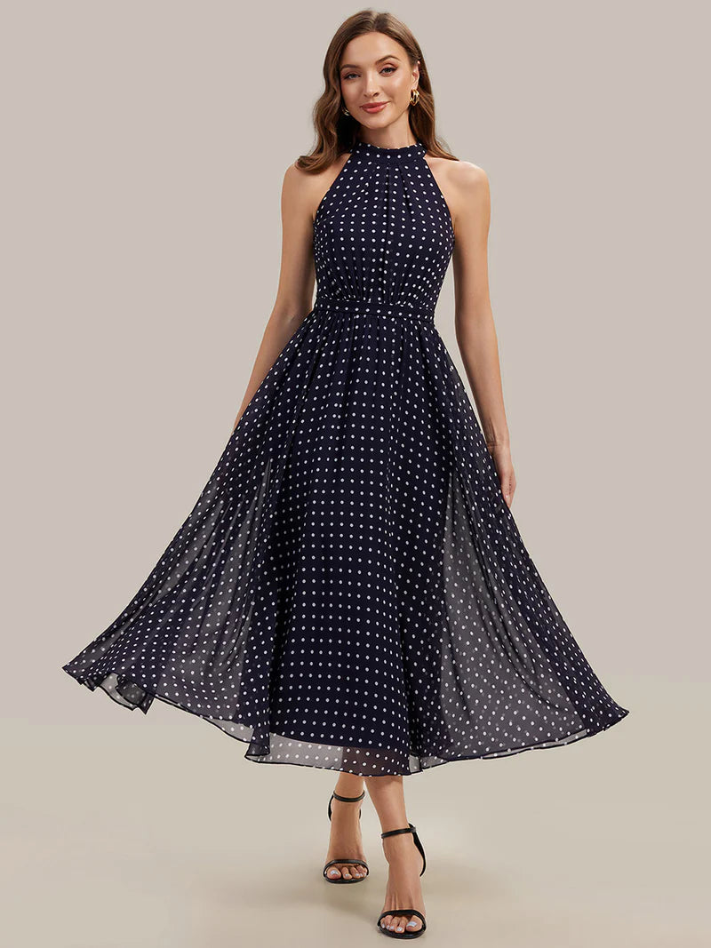Navy blue polka dot halter wedding guest dress or evening dress.