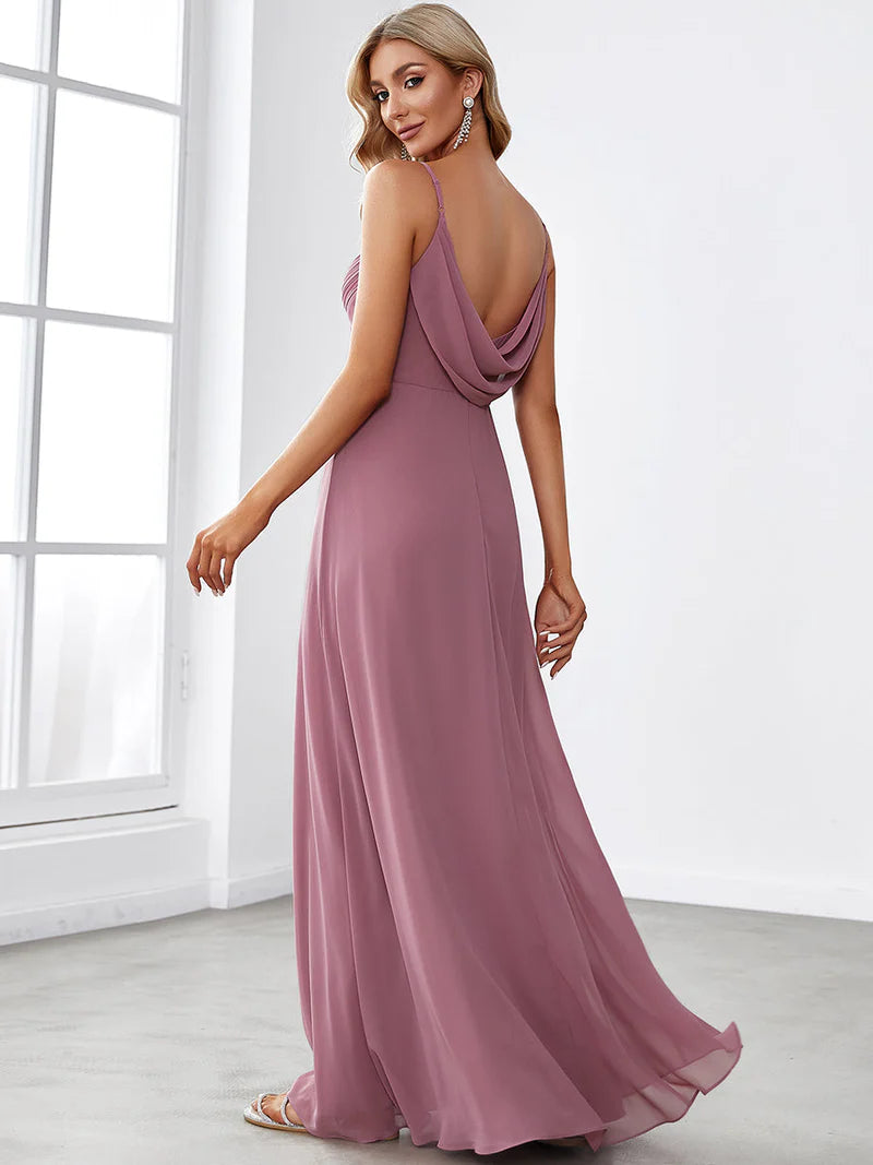 Sleeveless orchid bridesmaid dress with spaghetti straps.