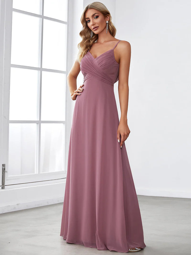 Sleeveless orchid pink bridesmaid dress or evening dress with spaghetti straps.
