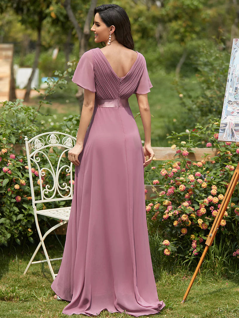 Orchid pink formal dress in chiffon with satin band and short sleeves.