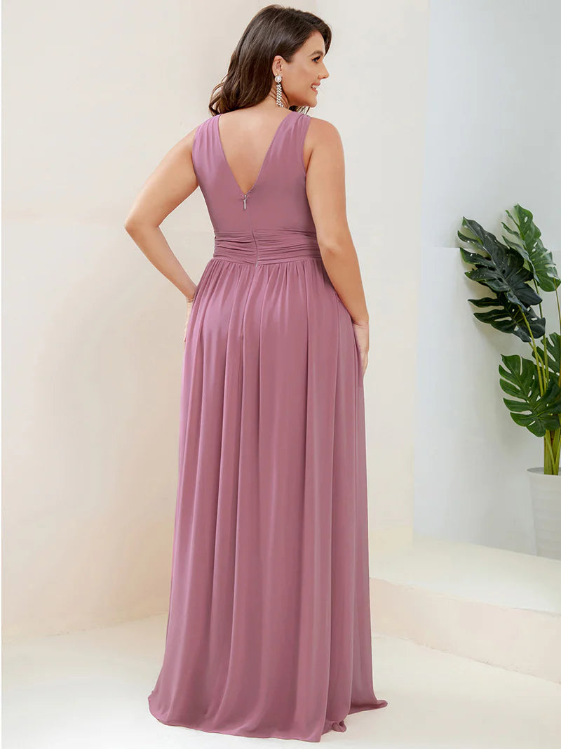 Orchid plus sized bridesmaid dress with double v-neck and chiffon.