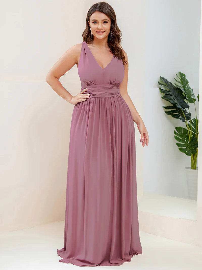 Orchid plus sized bridesmaid dress with double v-neck and chiffon.
