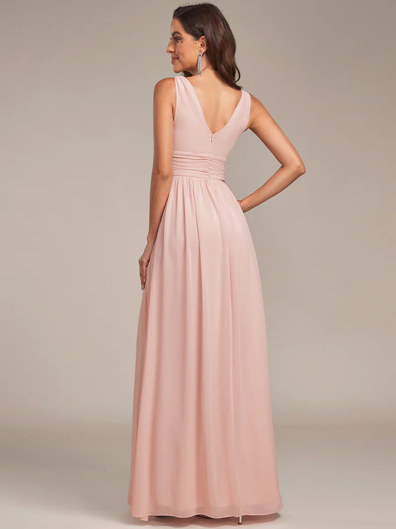 Pink bridesmaid dress with double v-neck and chiffon.
