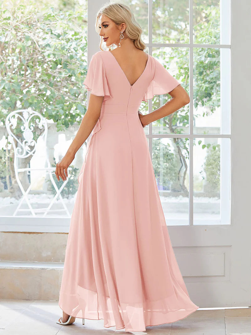 Pink bridesmaid dress with high low ruffle and chiffon.