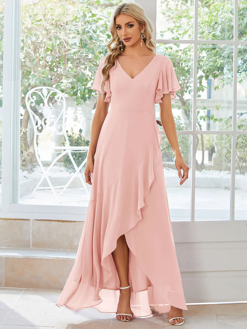Pink bridesmaid dress with high low ruffle and chiffon.