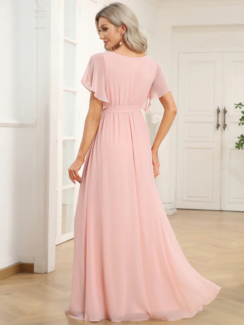 Pink bridesmaid dress with v-neck and a-line.