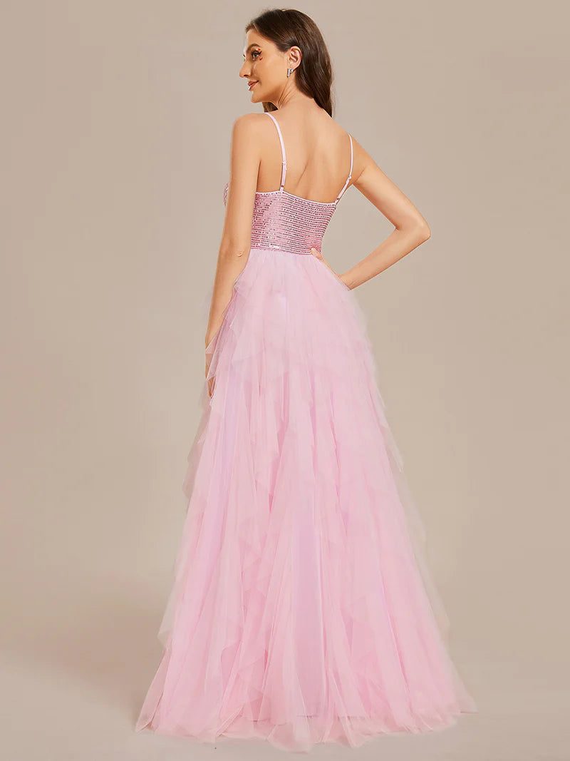 Pink formal layered tulle dress with sequin top and spaghetti straps.