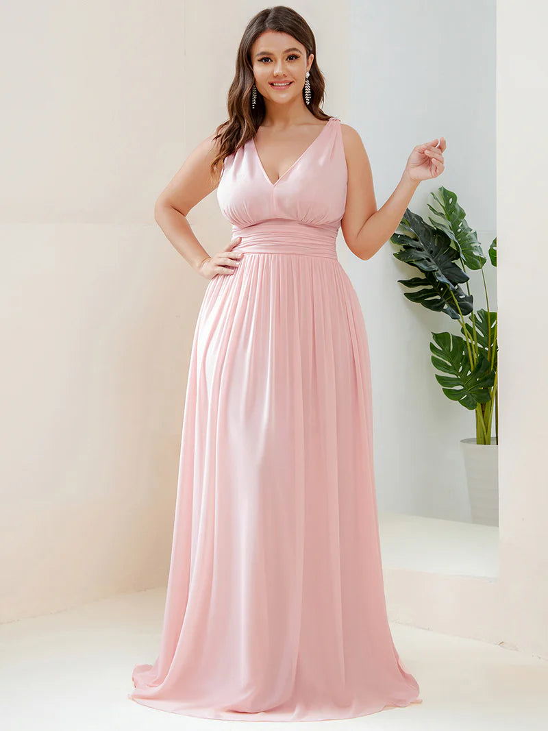 Pink plus sized bridesmaid dress with double v-neck and chiffon.