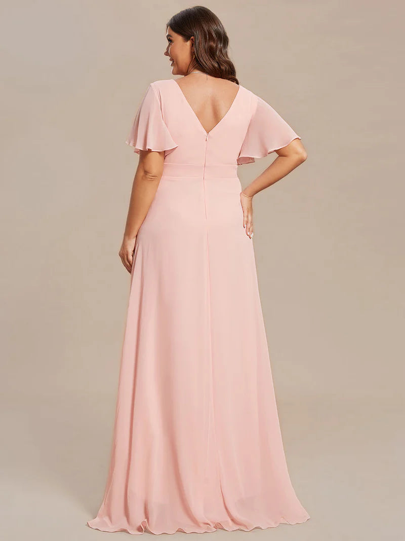 Pink plus sized bridesmaid dress with high low ruffle and chiffon.