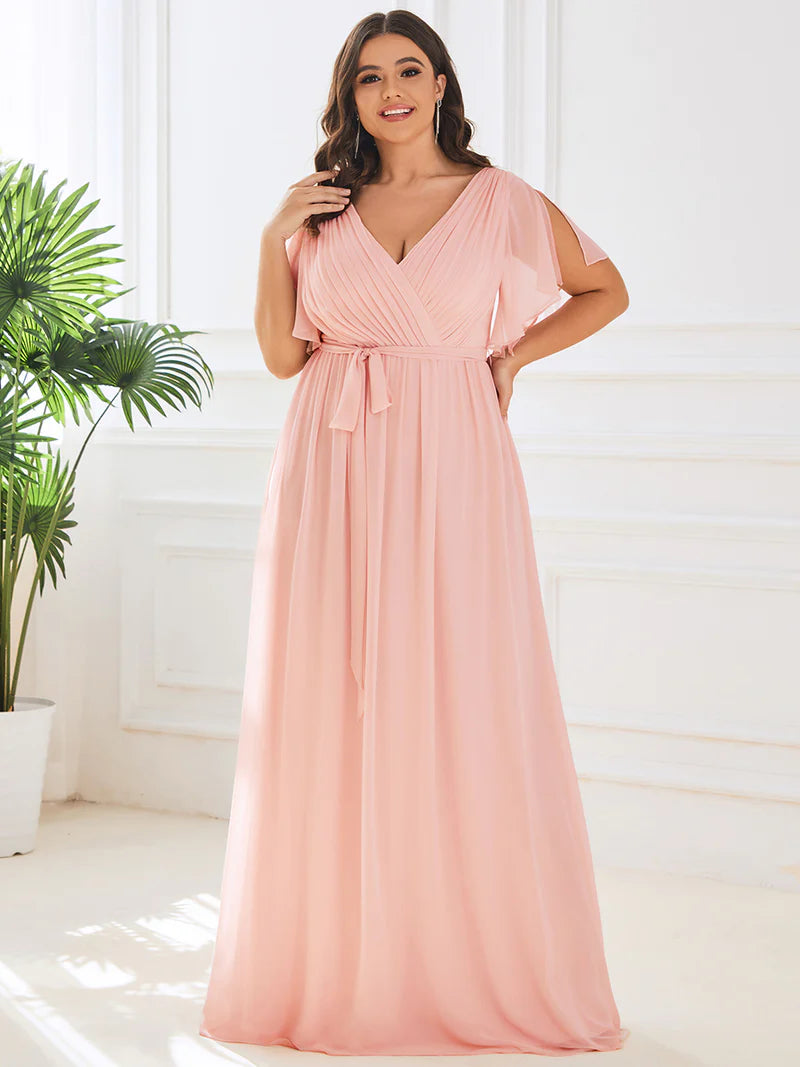 Pink plus sized bridesmaid dress with v-neck and a-line.