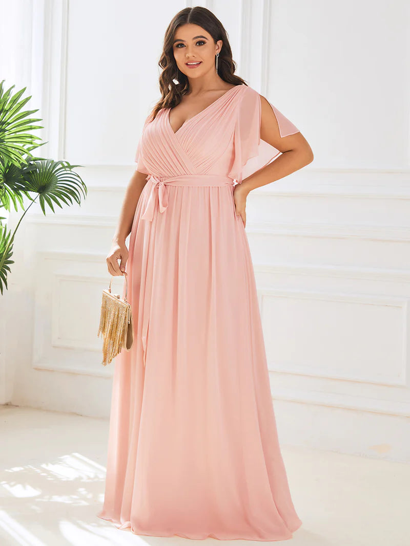 Pink plus sized bridesmaid dress with v-neck and a-line.