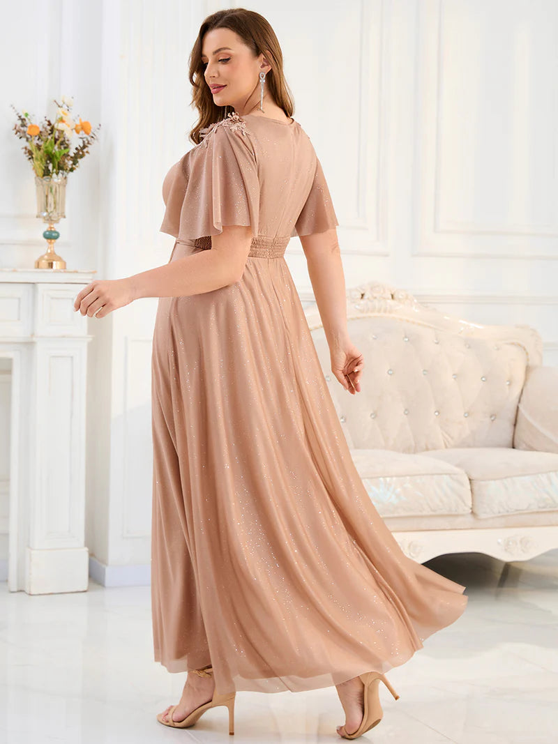 Rose gold plus size mother of the bride dress with short sleeves.