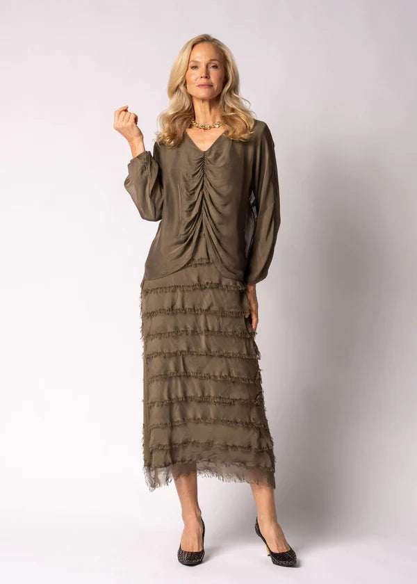 Silk green mother of the the bride dress with frayed edge skirt and ruched top.