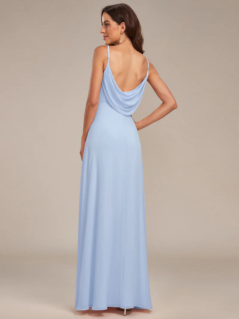Sleeveless sky blue bridesmaid dress with spaghetti straps.