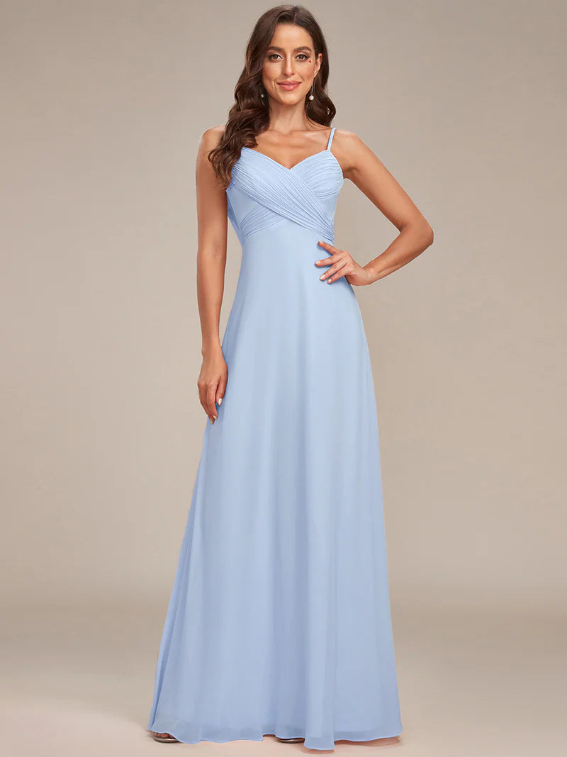 Sleeveless sky blue bridesmaid dress with spaghetti straps.