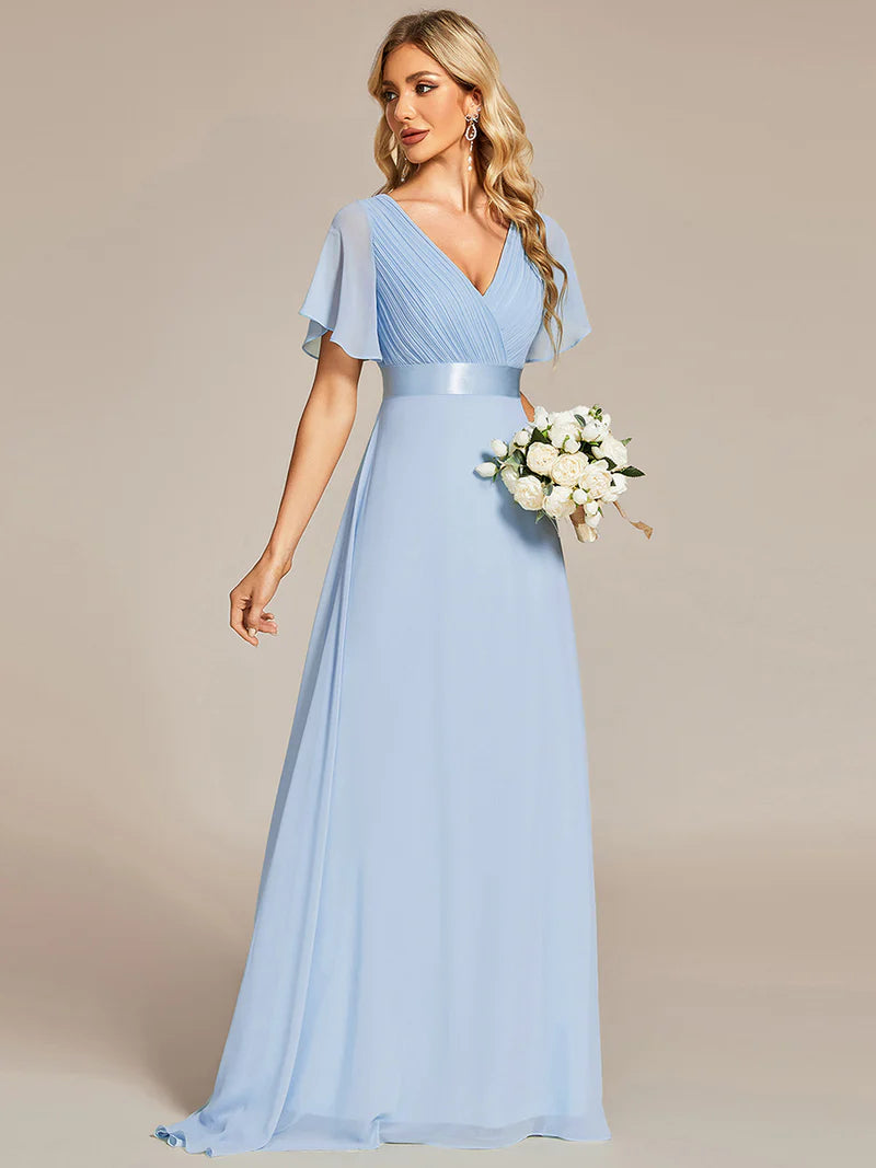 Sky blue formal dress in chiffon with satin band and short sleeves.
