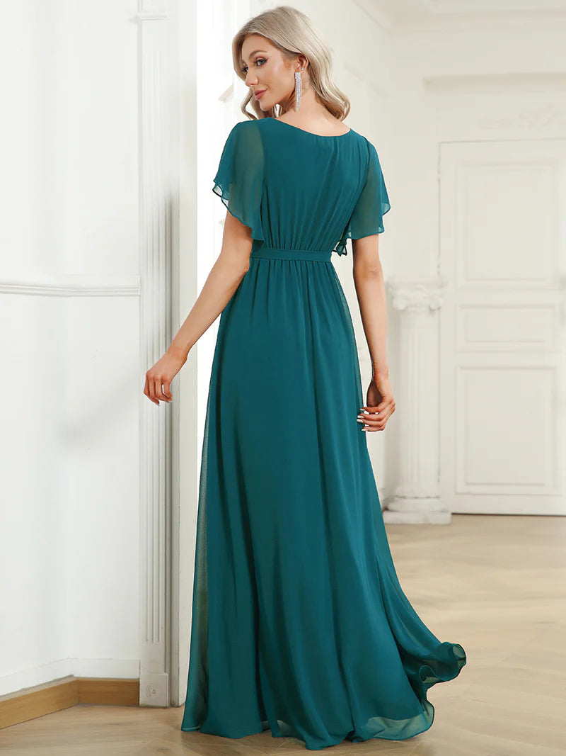 Teal bridesmaid dress with v-neck and a-line.