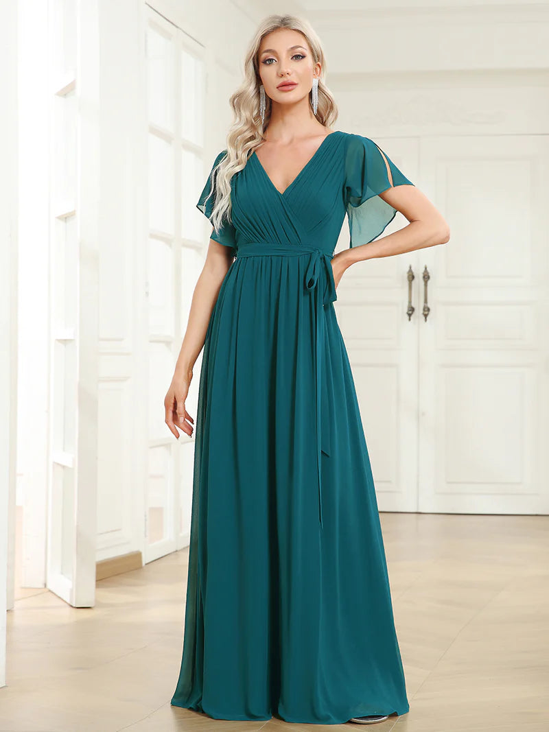 Teal bridesmaid dress with v-neck and a-line.