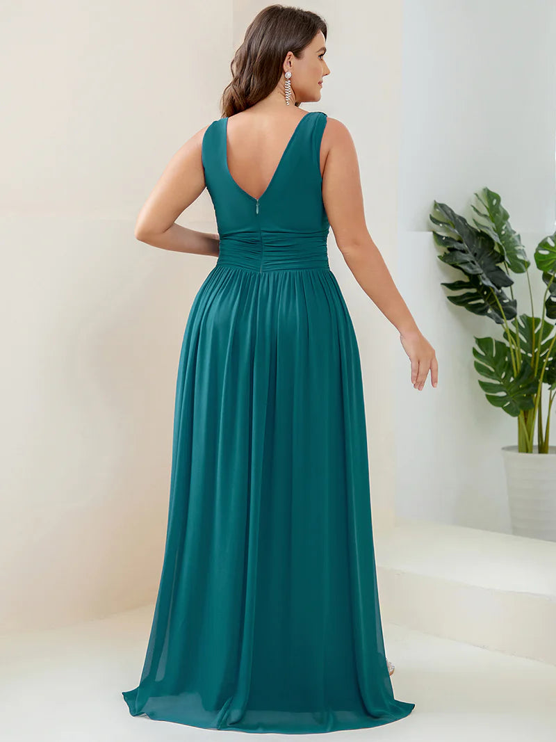 Teal plus sized bridesmaid dress with double v-neck and chiffon.