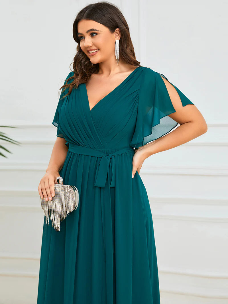 Teal plus sized bridesmaid dress with v-neck and a-line.