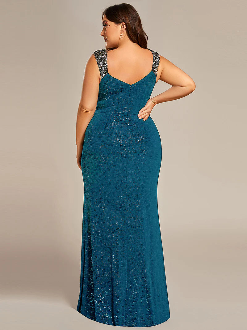 Teal plus sized formal dress with glitter and split front.