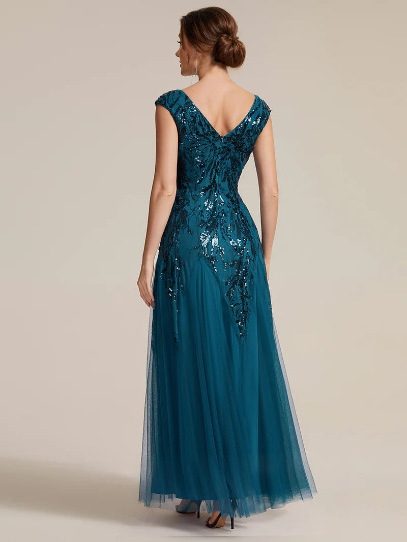 Teal sequin and tulle mother of the bride dress with short sleeve.