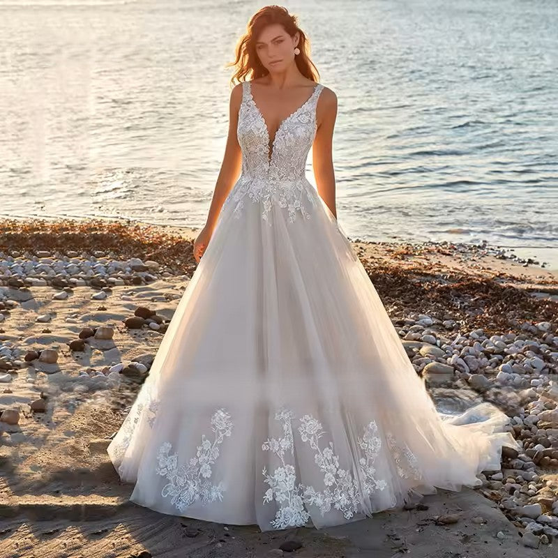 Wedding dress in ivory with tulle and applique detail.