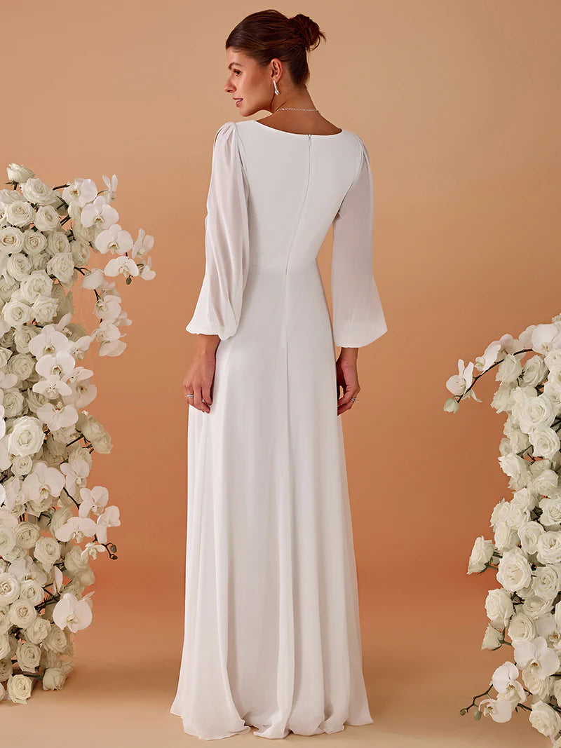 White long sleeve wedding dress with applique detail.