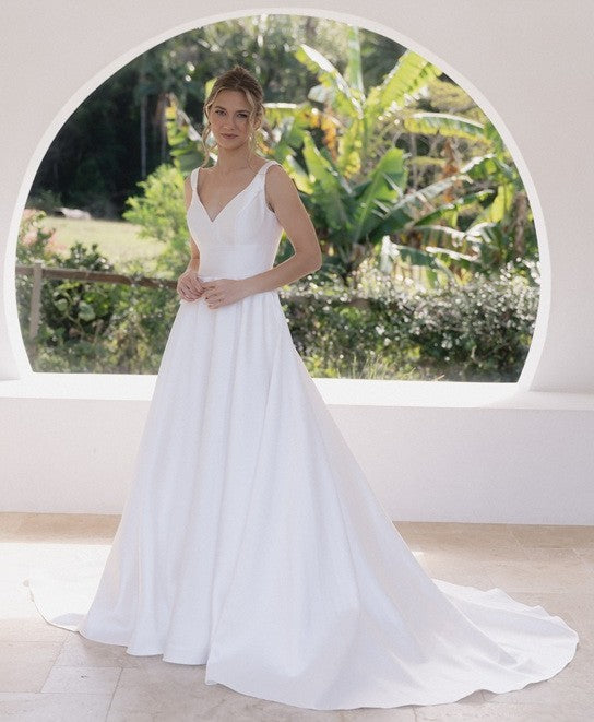 White plus size wedding dress in mikado satin with long train.