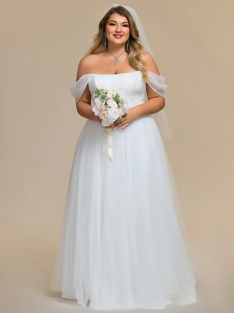 White Plus Size wedding dress with off the shoulder straps and lace up back.