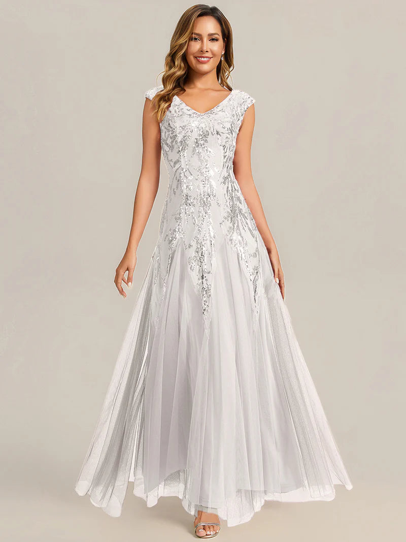 White sequin and tulle mother of the bride dress with short sleeve.