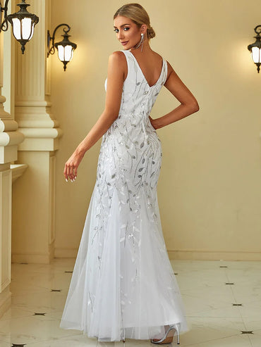 White wedding dress with fishtail and sequins.