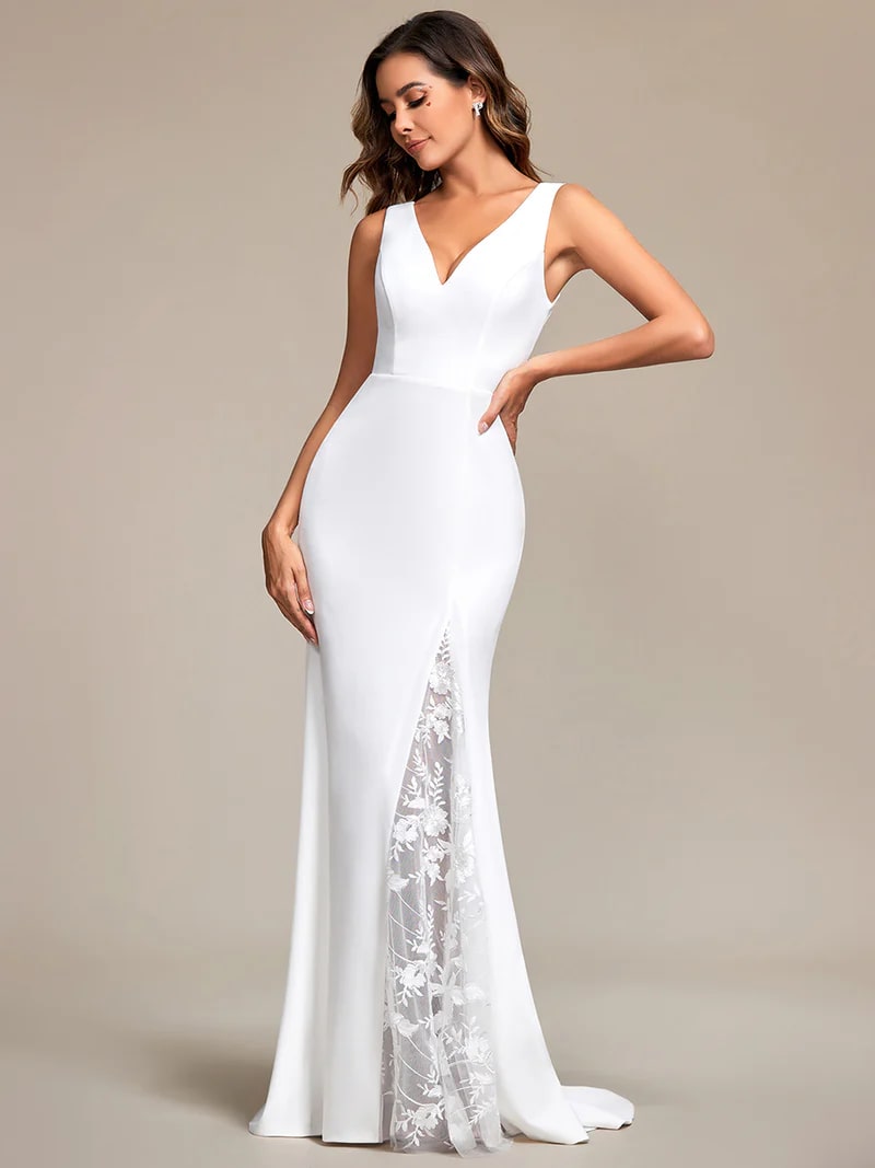 White wedding dress with spaghetti strap, fishtail and v-neck.