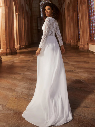 White wedding dress with long sleeves and laced back.
