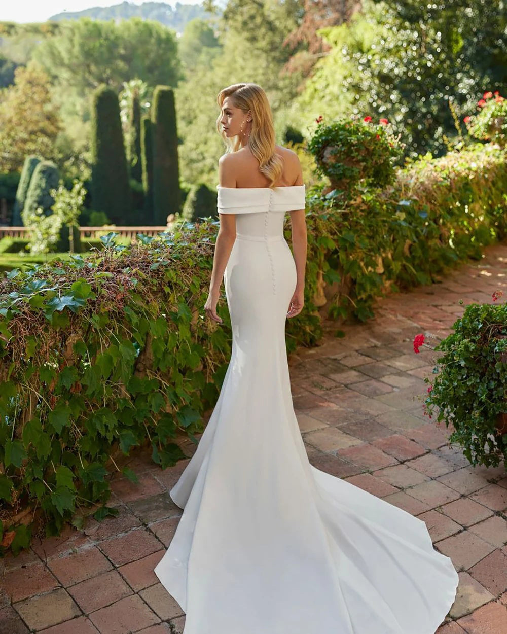 White wedding dress with off the shoulder mermaid tail and satin. Available in plus size.