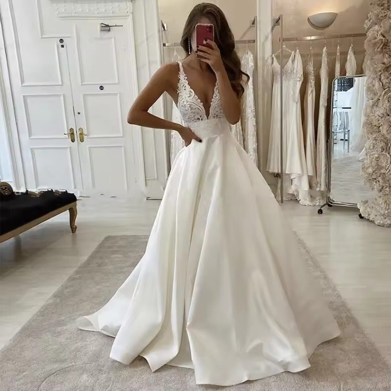 White wedding dress with v-neck, laced and satin. Available in plus size