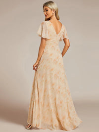 Apricot floral bridesmaid or mother of the bride dress with high low ruffle and chiffon.