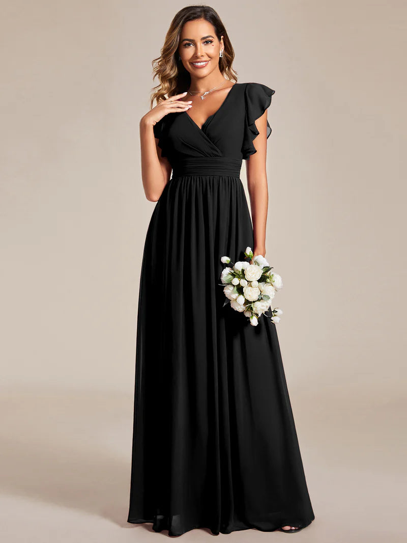 Black bridesmaid dress with ruffle sleeve and open back detail.