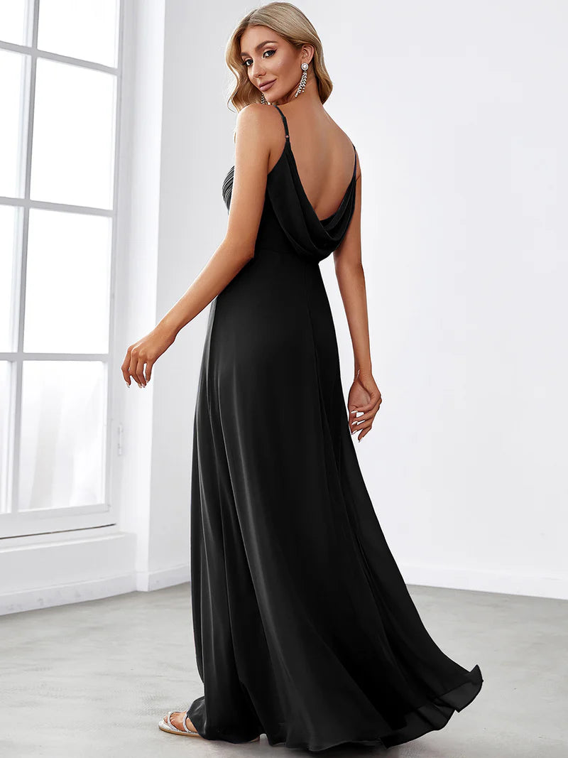 Sleeveless black bridesmaid dress with spaghetti straps.