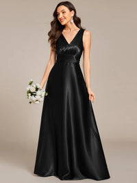 Black satin bridesmaid dress with v-neck and pockets.