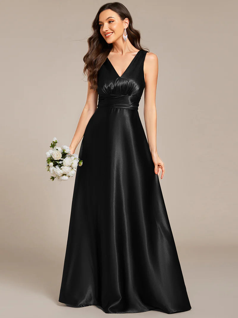 Black satin bridesmaid dress with v-neck and pockets.