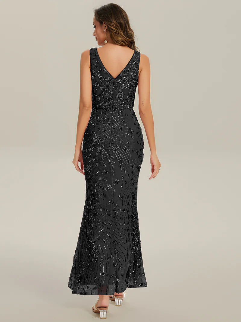 Black formal dress with deep v neck and a split.