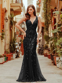 Black formal dress with fishtail and sequins.