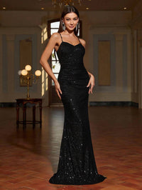Black formal dress with lace up back and sequins.
